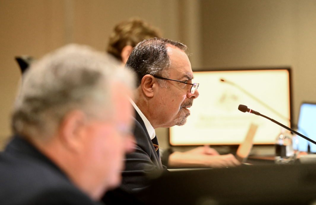 Picture taken at the Sydney Hearing Block 2, Commissioners Kaldas can be seen
sitting behind a desk speaking.